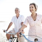 retired couple happy on the beach